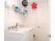 Well-lit laundry room features a washer, dryer, storage shelves, and a clean, organized space at 707 Staffora St, Haines City, FL 33844