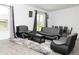 Elegant living area with stylish gray furniture, a sliding glass door, and modern decor at 707 Staffora St, Haines City, FL 33844