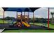 A view of the community playground with climbing structures, slides, and benches at 707 Staffora St, Haines City, FL 33844