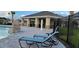 Poolside lounge area with comfortable seating, a shower, and a cabana at 707 Staffora St, Haines City, FL 33844