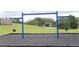 A set of swings with blue posts and a black mulch base, creating a playful environment for  at 707 Staffora St, Haines City, FL 33844