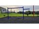 Community swing set, with swings and benches surrounded by green spaces at 707 Staffora St, Haines City, FL 33844