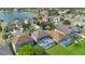 Scenic aerial view capturing the community's pool, well manicured lawns and serene lake access at 726 Lake Biscayne Way, Orlando, FL 32824