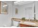 Elegant bathroom vanity with granite countertop, decorative mirror, and modern fixtures, providing a serene space at 726 Lake Biscayne Way, Orlando, FL 32824