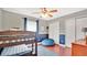 Bright bedroom with bunk beds, ceiling fan, and blue accents, ideal for or guests at 726 Lake Biscayne Way, Orlando, FL 32824