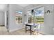Cozy breakfast nook featuring bright windows, a table, and a view of the pool at 726 Lake Biscayne Way, Orlando, FL 32824