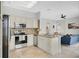 Bright kitchen featuring stainless appliances, granite countertops, and tile backsplash at 726 Lake Biscayne Way, Orlando, FL 32824