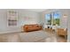 Bright living room with tan tile flooring, stylish furniture, and sunlit windows at 726 Lake Biscayne Way, Orlando, FL 32824