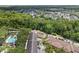 Community aerial showcasing mature landscaping, a pool, and diverse housing options at 754 Centervale Dr, Kissimmee, FL 34747