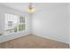 Bedroom featuring carpet, a ceiling fan, and a bright window offering a lovely view at 754 Centervale Dr, Kissimmee, FL 34747