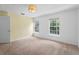 Well-lit bedroom featuring plush carpet, a ceiling fan, and a pair of windows at 754 Centervale Dr, Kissimmee, FL 34747