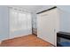 Bedroom with murphy bed, closet and wood laminate flooring and natural light at 754 Centervale Dr, Kissimmee, FL 34747