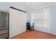Bright bedroom featuring a convenient Murphy bed, natural light, and wood floors at 754 Centervale Dr, Kissimmee, FL 34747