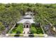 Aerial view of a lush community clubhouse surrounded by mature trees at 754 Centervale Dr, Kissimmee, FL 34747