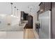Open kitchen featuring stainless steel appliances, granite countertops and tile flooring at 754 Centervale Dr, Kissimmee, FL 34747