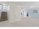 Open floor plan showcasing tile floors and easy access to the kitchen and staircase at 754 Centervale Dr, Kissimmee, FL 34747