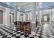 Beautifully designed lobby with a bar area and elegant black and white checkered floors at 754 Centervale Dr, Kissimmee, FL 34747