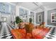 Inviting lobby featuring comfortable seating and a vibrant orange rug on checkered floors at 754 Centervale Dr, Kissimmee, FL 34747