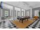 Spacious lobby with comfortable seating areas and a classic black and white checkered floor at 754 Centervale Dr, Kissimmee, FL 34747
