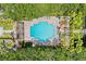 Aerial view of the community pool with lounge chairs and manicured landscaping at 754 Centervale Dr, Kissimmee, FL 34747