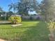 Lush backyard featuring manicured lawn, mature trees, and a storage shed, perfect for outdoor enjoyment at 766 Canovia Ave, Orlando, FL 32804