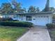 Charming single-story home with well-maintained landscaping and an attached one car garage at 766 Canovia Ave, Orlando, FL 32804