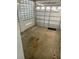 Spacious garage area with a functional roll-up door and ventilation from glass block windows at 766 Canovia Ave, Orlando, FL 32804