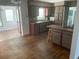 Spacious kitchen with dark countertops, wood floors and barstool seating at 766 Canovia Ave, Orlando, FL 32804