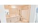Bright bathroom with double sink vanity and shower featuring a white shower curtain at 853 Bocavista Ct, Davenport, FL 33896