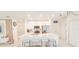 Bright kitchen with large island, stainless steel appliances and white cabinets at 853 Bocavista Ct, Davenport, FL 33896