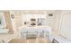 Modern kitchen features stainless steel appliances, an island, and white cabinets at 853 Bocavista Ct, Davenport, FL 33896