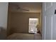 Cozy bedroom featuring neutral tones, a ceiling fan, and natural light from the window at 8564 Bay Lilly Loop, Kissimmee, FL 34747