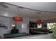 Large game room featuring pool tables, a bar, and Budweiser decorations at 8564 Bay Lilly Loop, Kissimmee, FL 34747