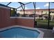 Refreshing pool area enclosed with screen, offering a private outdoor space at 8564 Bay Lilly Loop, Kissimmee, FL 34747