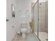 Clean bathroom with a glass-enclosed shower, tile flooring, and contemporary design at 894 Pebble Crest Ln, Eagle Lake, FL 33839