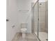 Bathroom featuring a glass-enclosed tiled shower at 894 Pebble Crest Ln, Eagle Lake, FL 33839