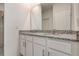 Bathroom featuring dual sinks set in a granite countertop at 894 Pebble Crest Ln, Eagle Lake, FL 33839
