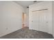 Bedroom featuring neutral walls, carpet flooring, and closet with sliding doors at 894 Pebble Crest Ln, Eagle Lake, FL 33839