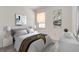 Relaxing bedroom with a neutral color scheme, a cozy rug, and stylish decorative accents at 894 Pebble Crest Ln, Eagle Lake, FL 33839