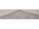 Close-up of soft, patterned gray carpeting with white trim at 894 Pebble Crest Ln, Eagle Lake, FL 33839