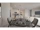 Open-concept dining room flowing into kitchen, perfect for entertaining and Gathering meals at 894 Pebble Crest Ln, Eagle Lake, FL 33839