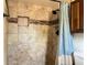 Bathroom shower with nice tile work and shower caddy at 909 Royalton Rd, Orlando, FL 32825