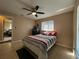 Bedroom with colorful quilt and tan walls at 909 Royalton Rd, Orlando, FL 32825