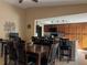 Open-concept dining room with bar seating adjacent to the modern kitchen at 909 Royalton Rd, Orlando, FL 32825