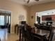 Bright dining area open to living room, featuring neutral tones and tile floors at 909 Royalton Rd, Orlando, FL 32825