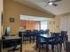 Dining room with a bar and barstools separating it from the kitchen at 909 Royalton Rd, Orlando, FL 32825