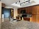 This kitchen features dark wood cabinets, granite countertops, and stainless steel appliances at 909 Royalton Rd, Orlando, FL 32825