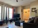 Cozy living room with large windows, tile flooring, and comfortable seating at 909 Royalton Rd, Orlando, FL 32825