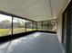 Enclosed patio offering views of the backyard and providing ample space for enjoying the outdoors, perfect for entertaining at 909 Royalton Rd, Orlando, FL 32825