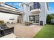Backyard featuring a paved patio with a seating area and dining table at 9443 Merrifield St, Orlando, FL 32827